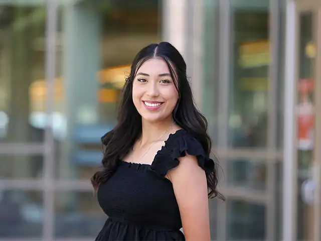 female student headshot outside the library