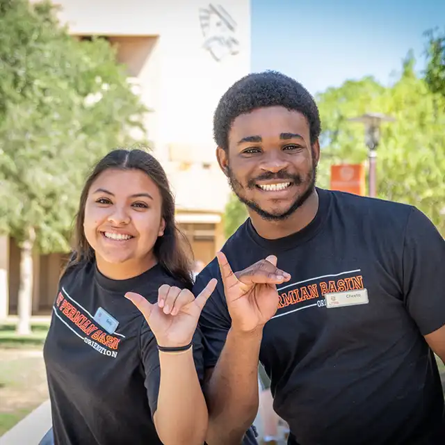 Two UTPB students with falcons up