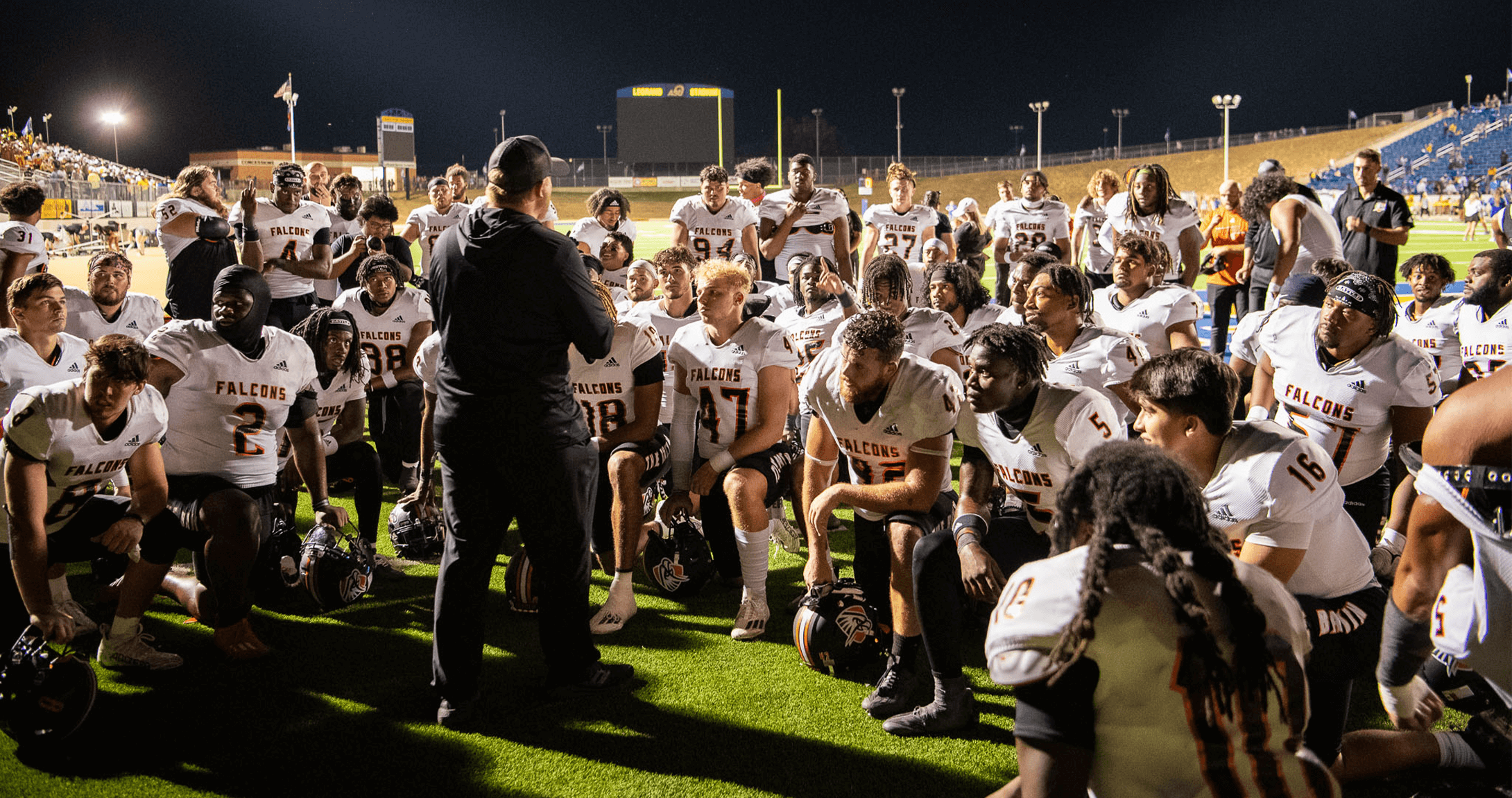 Falcons huddle together after 28-23 win over Angelo State