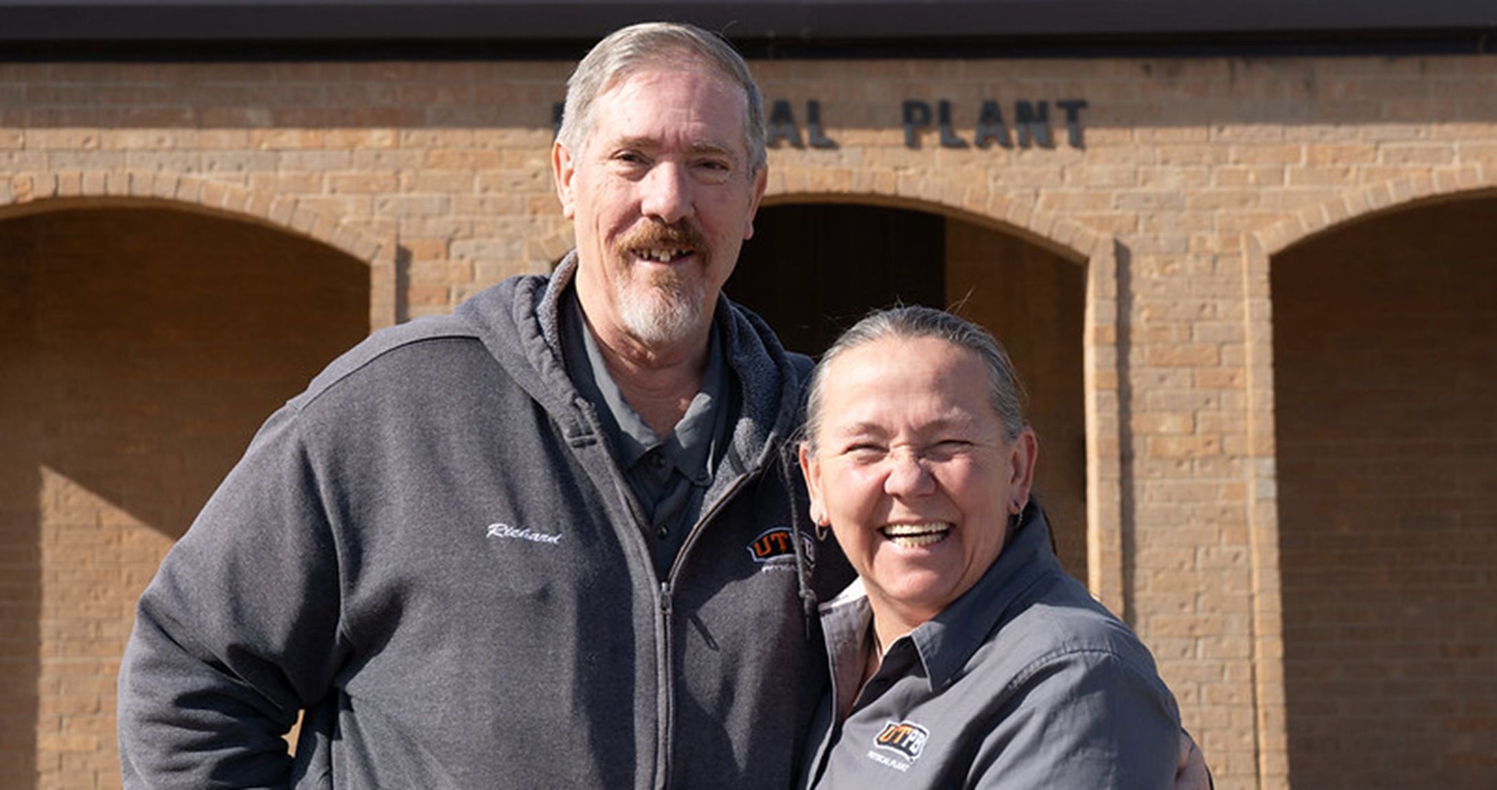 The Gantenbeins smiling at camera