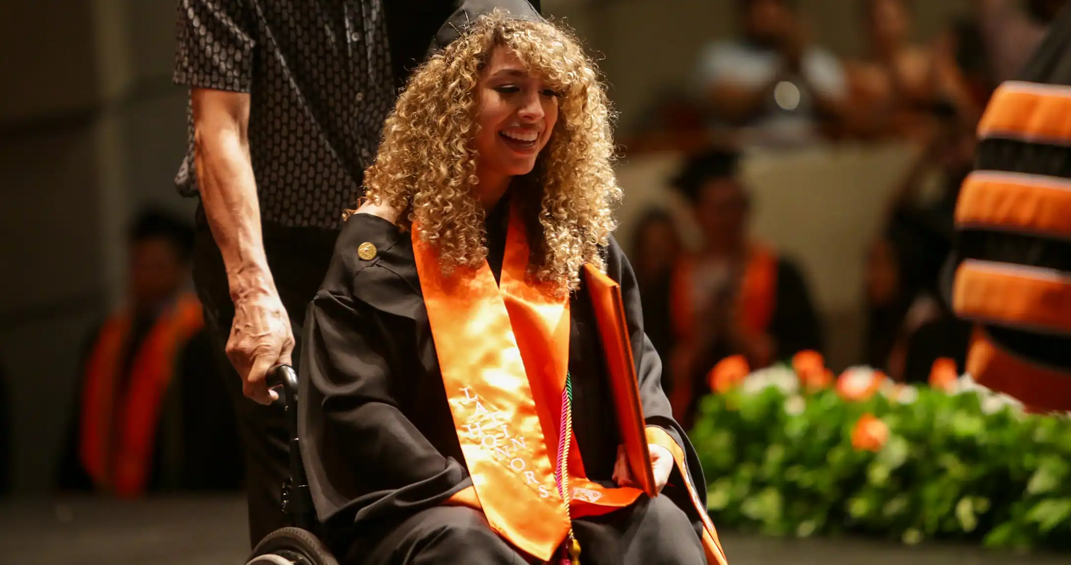 Barlett Caballero crossing the stage at UTPB graduation. 