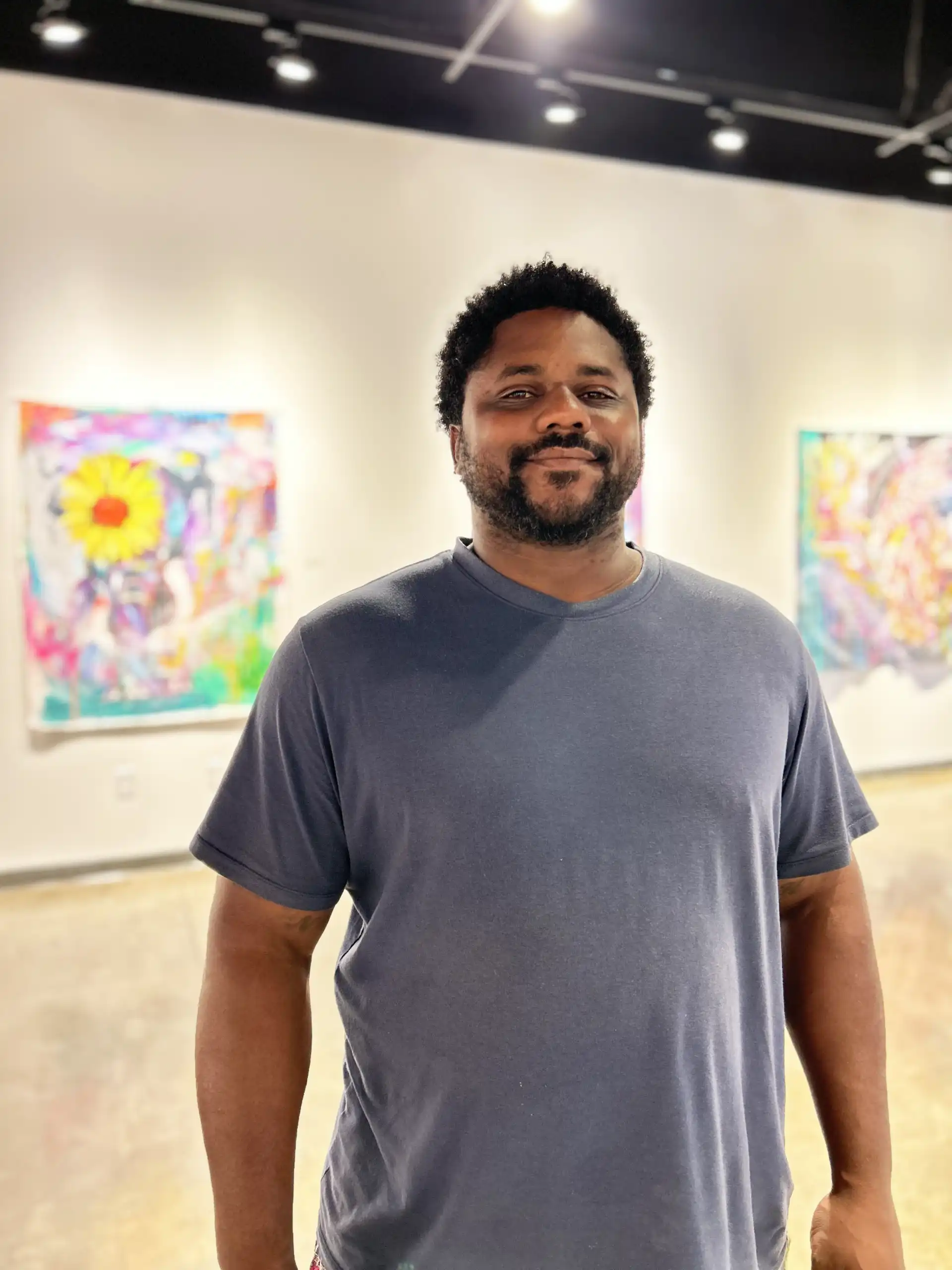 Baron Batch standing in his gallery at UTPB.