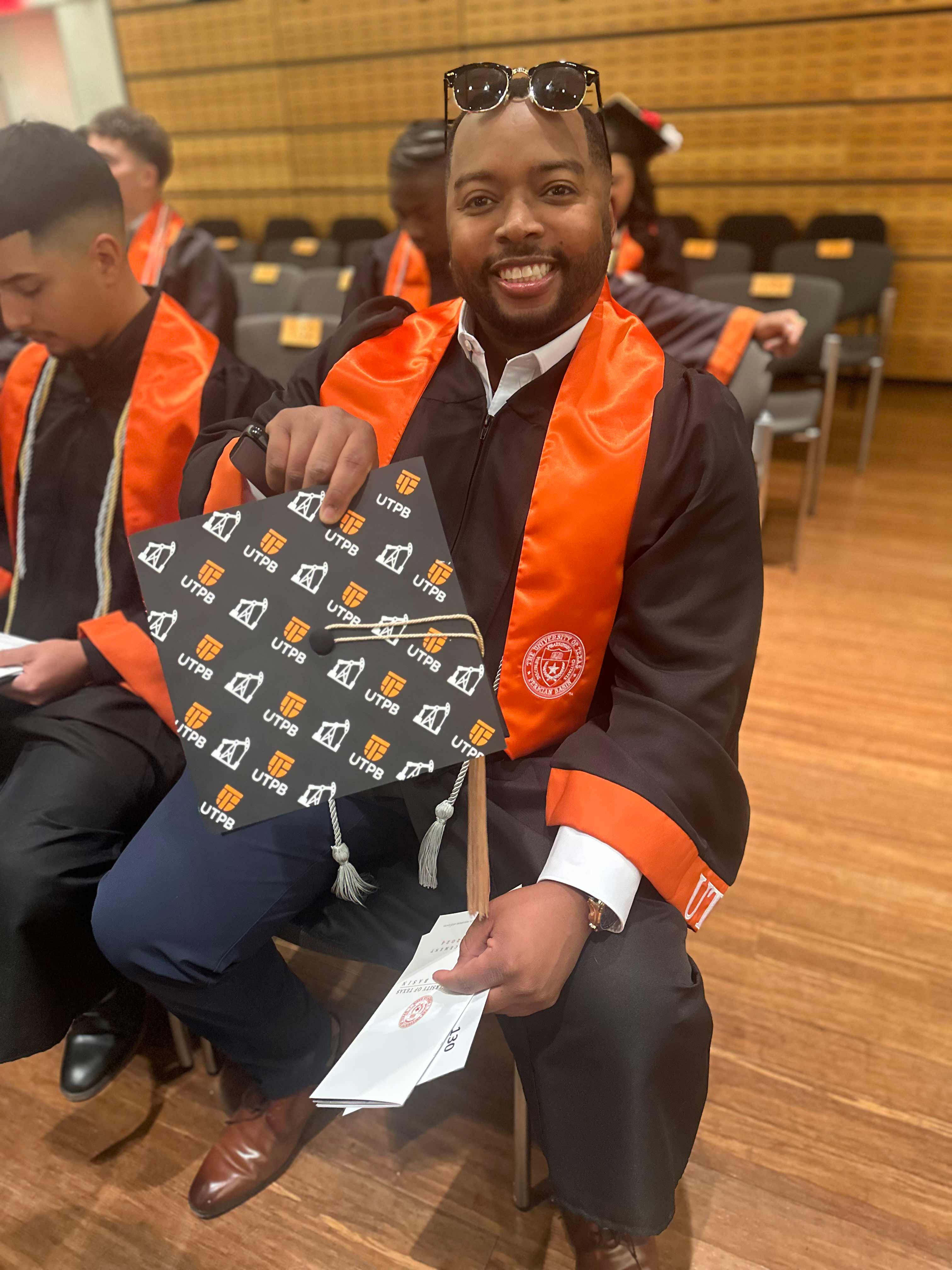 Damien Wright showing off his graduation cap
