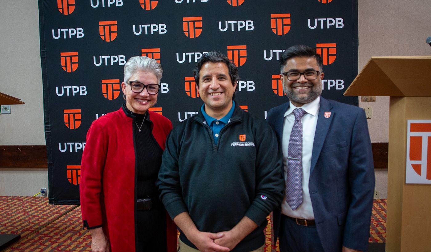 Employee of the Year winner with president and provost