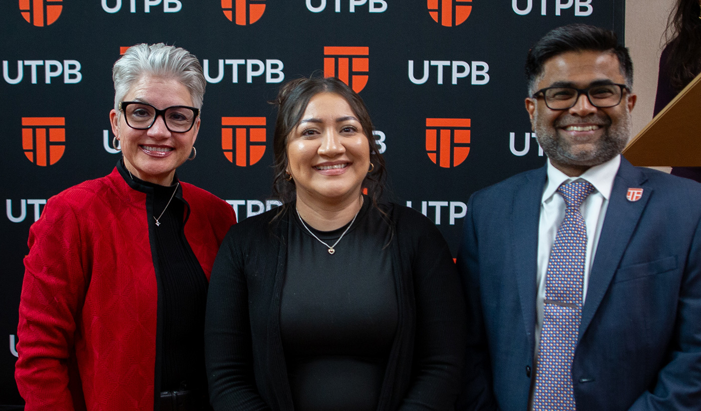 Enhancing Student Experience Award winner with president and provost