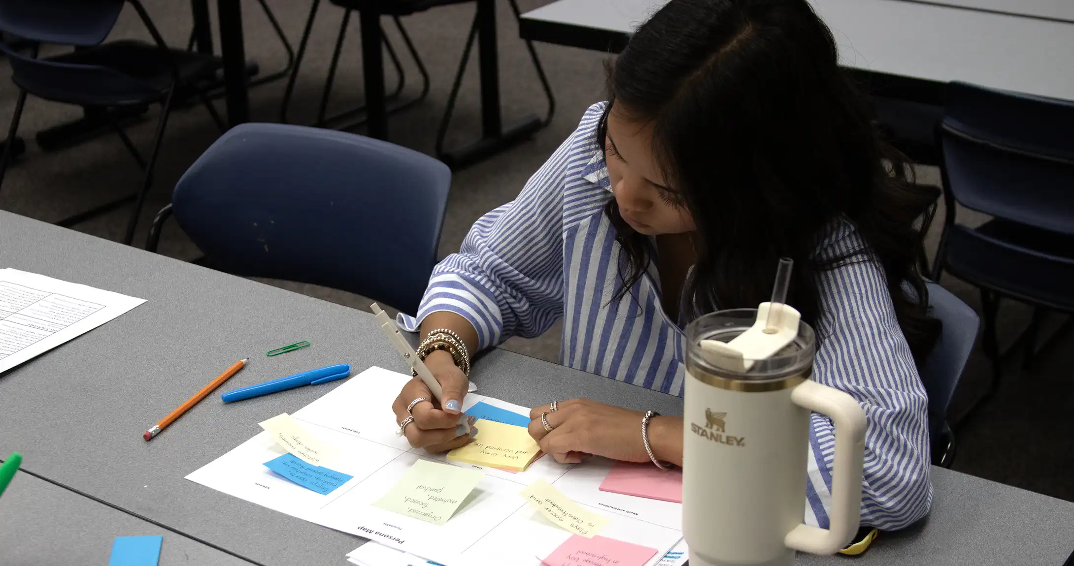 UTPB Student working on projects in a graphic design class.