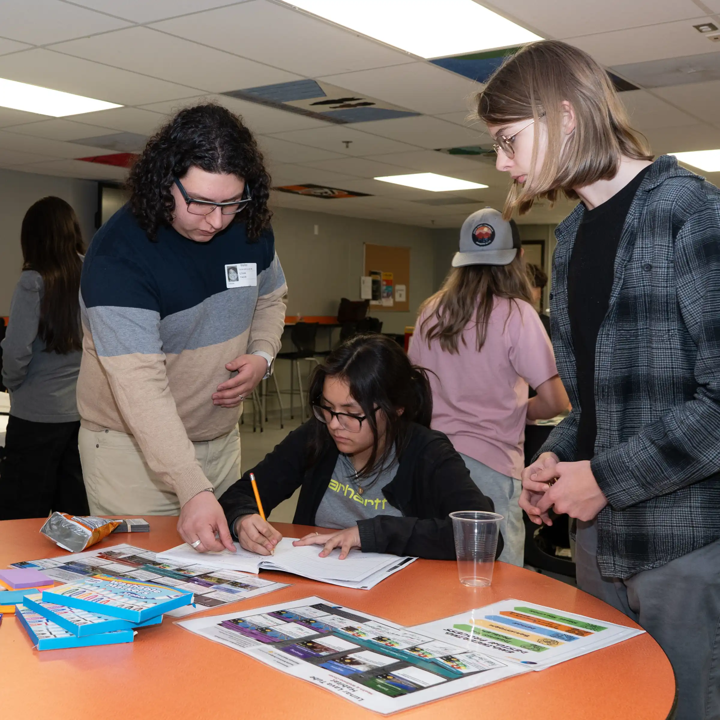 UTPB student assisting middle school student with STEM work