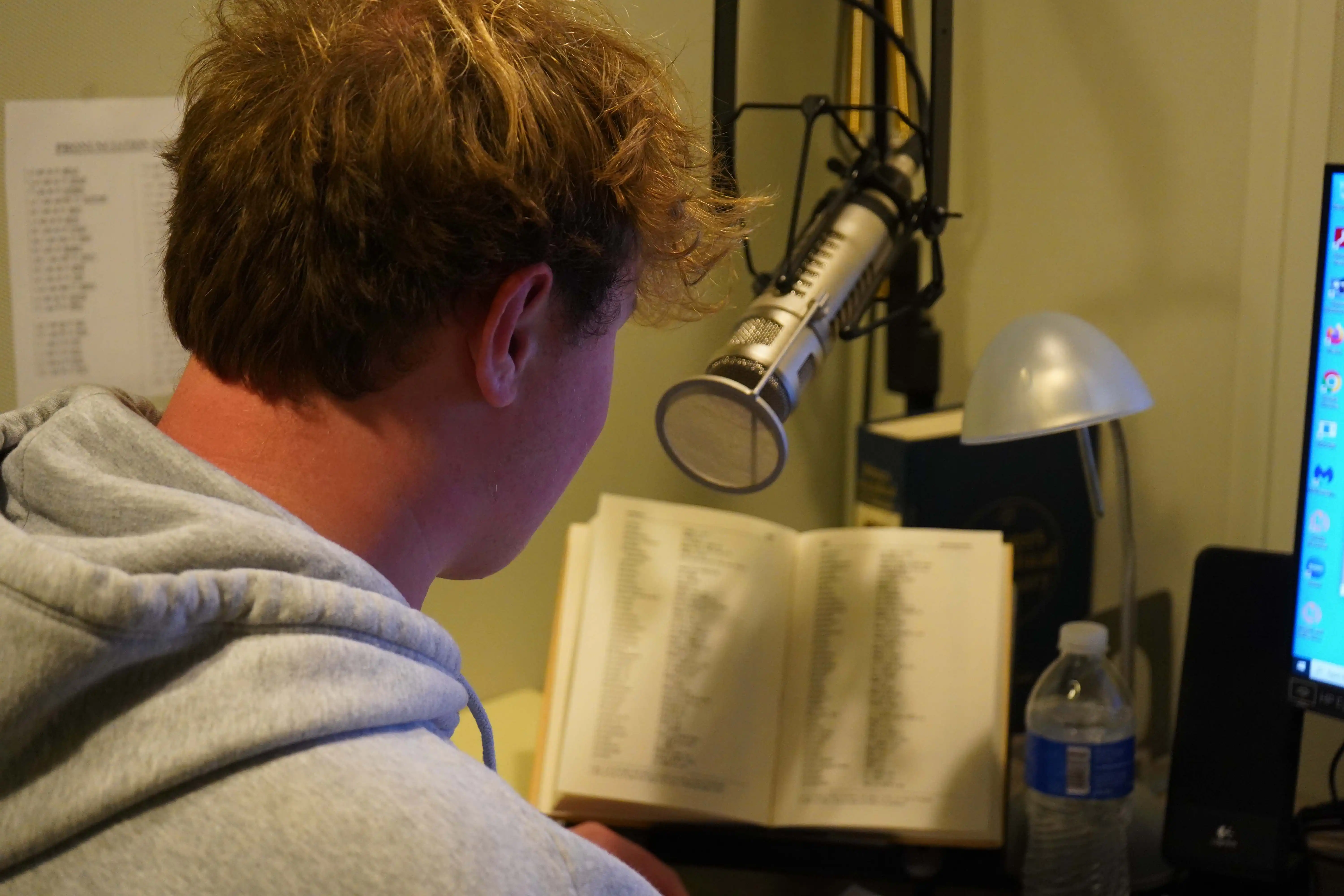 UTPB student recording an audiobook at the Recording Library of West Texas.