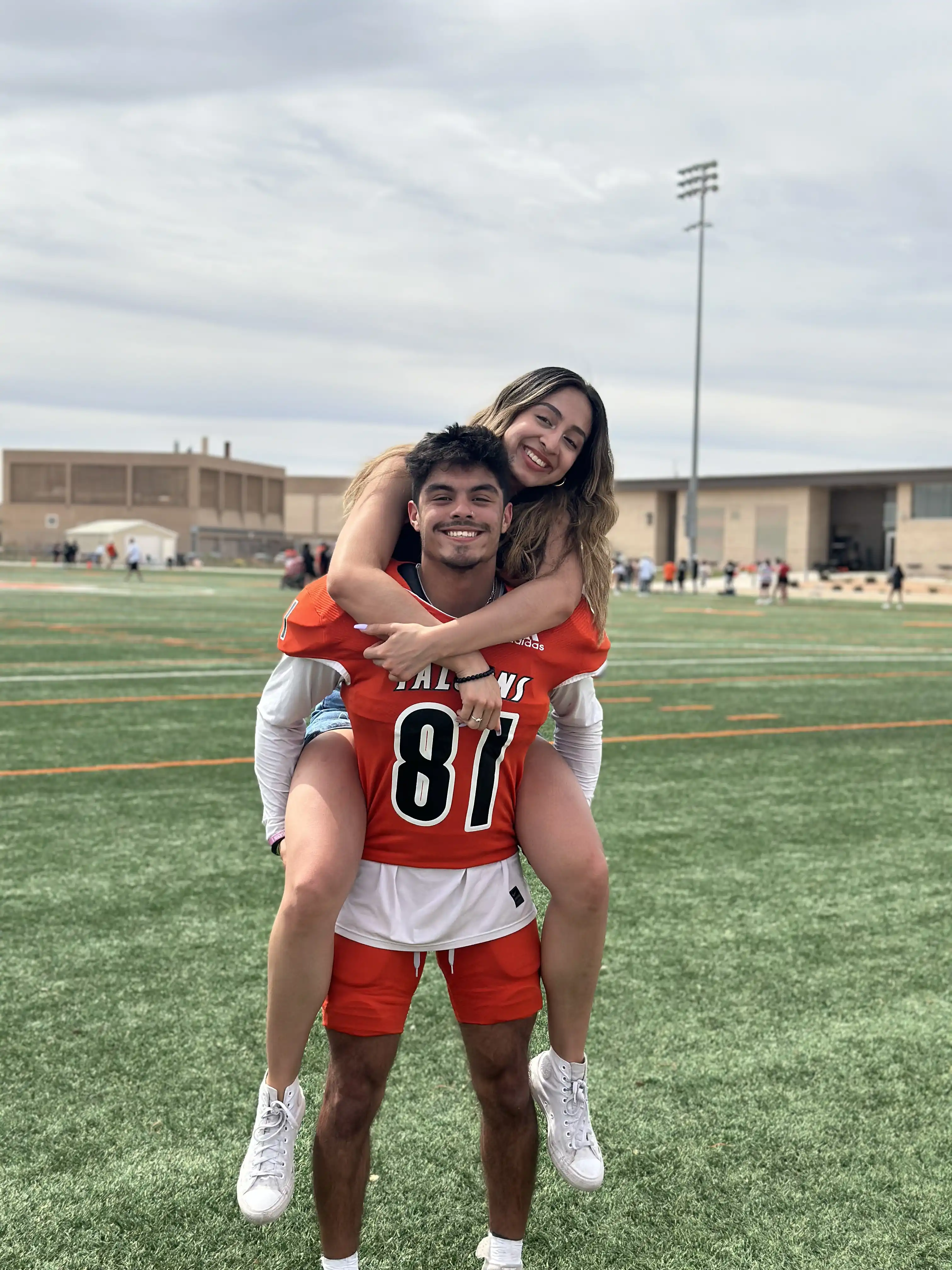 Alex Sanchez and Matthew on UTPB's practice football field. 