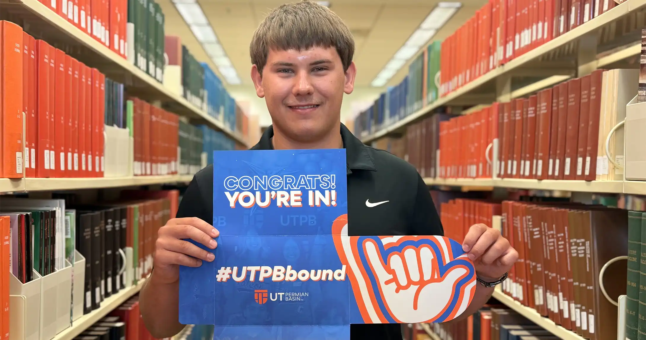 Braden Woody holding his UTPB acceptance letter. 