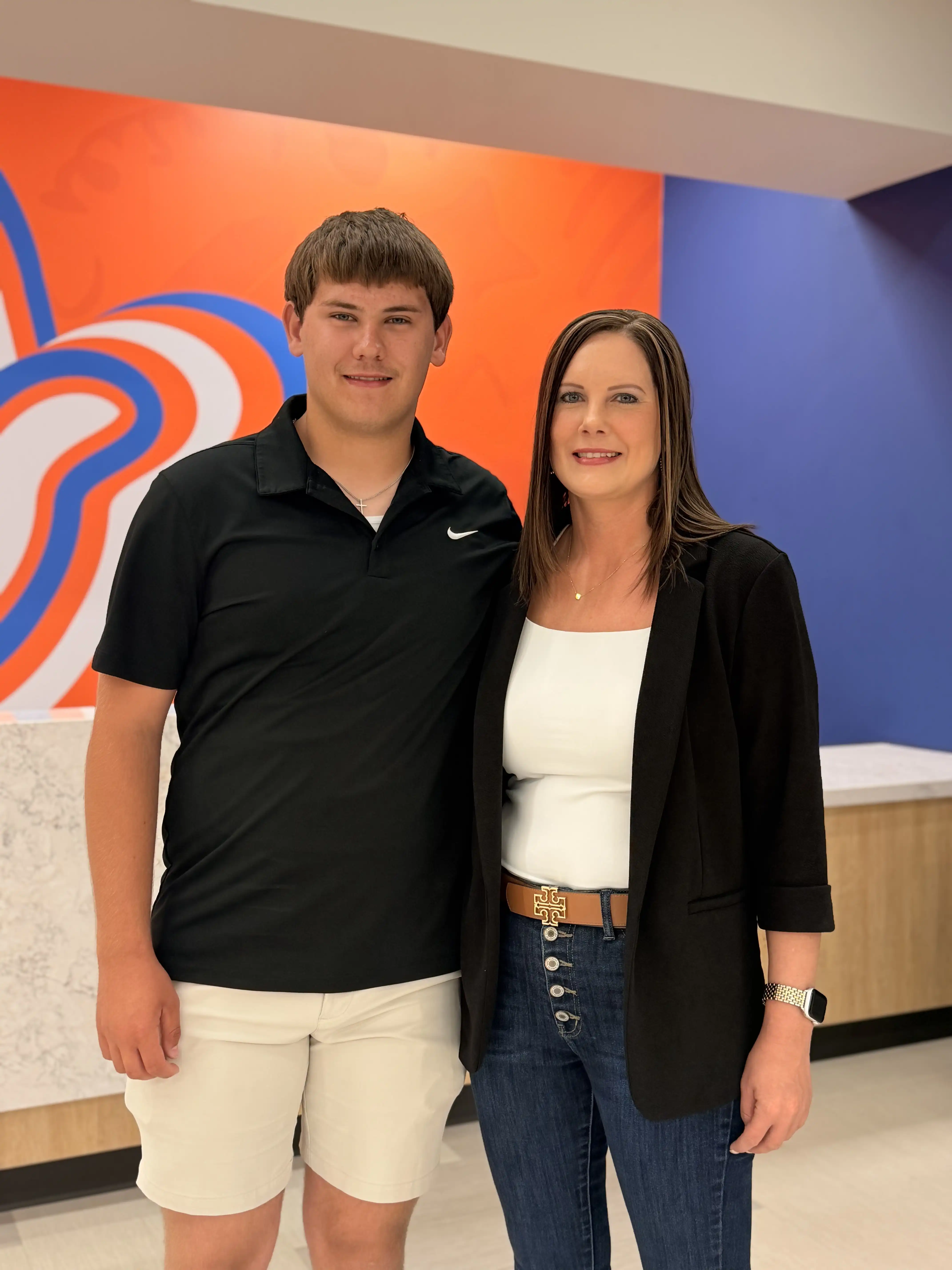 Braden and his mom, Lynsey Woody, standing in the UTPB Mesa building. 