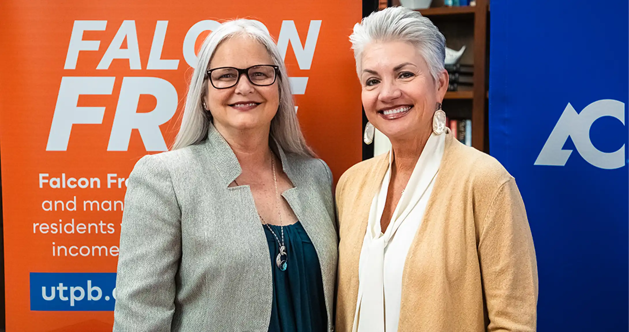 Dr. Conner, Amarillo College President, and Dr. Woodley, UTPB President, standing together at the partnership celebration. 