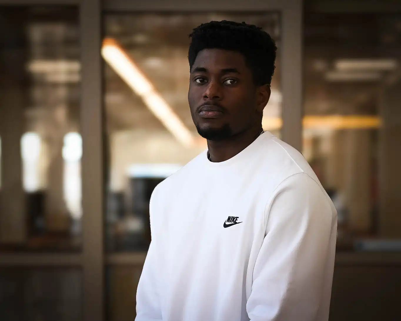 Echi Onyemaobi taking his headshot in the on-campus library. 