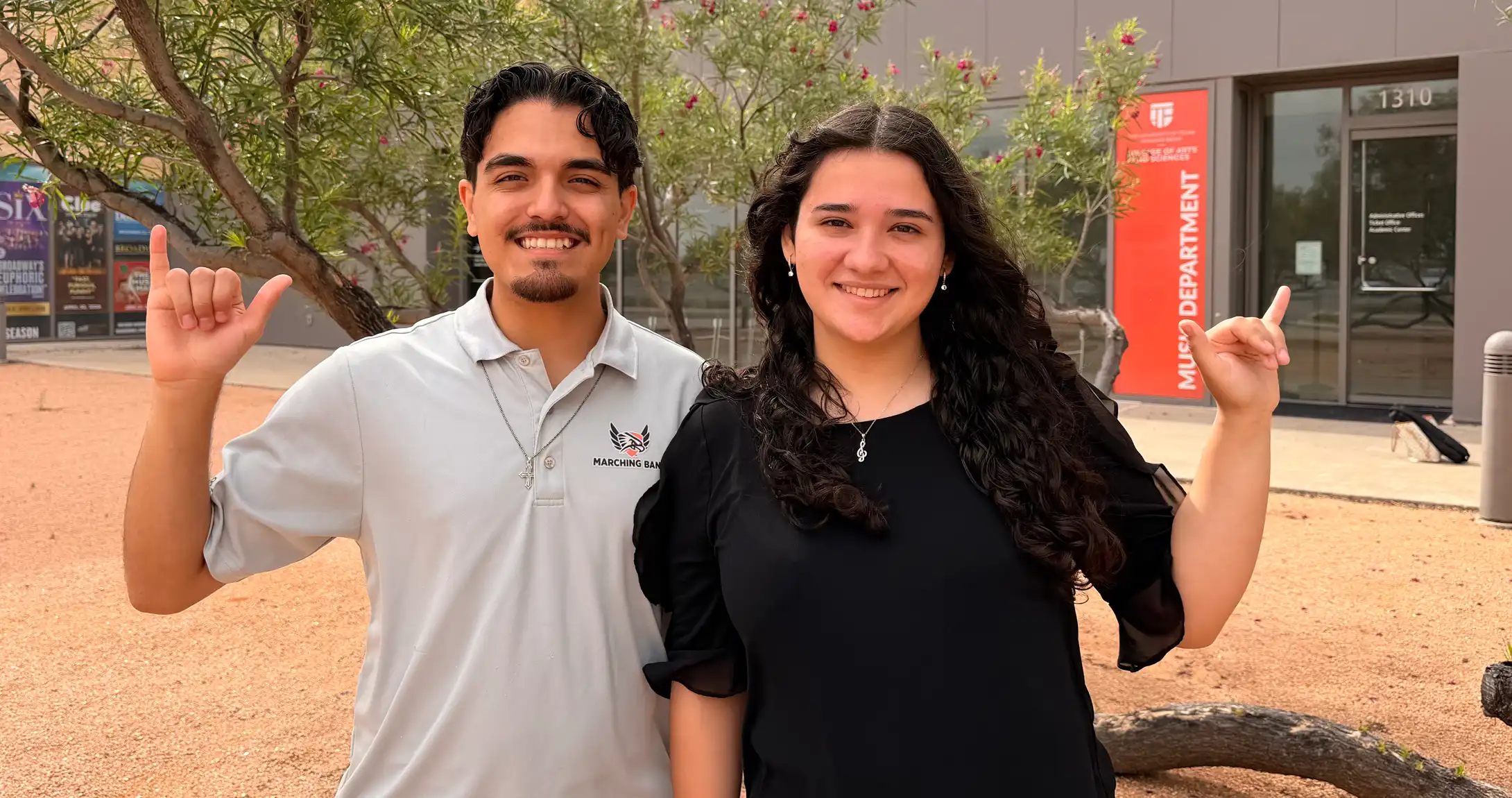 UTPB music education students Daniela Salinas and Steven Marin posing for a photo outside of the music department building. 