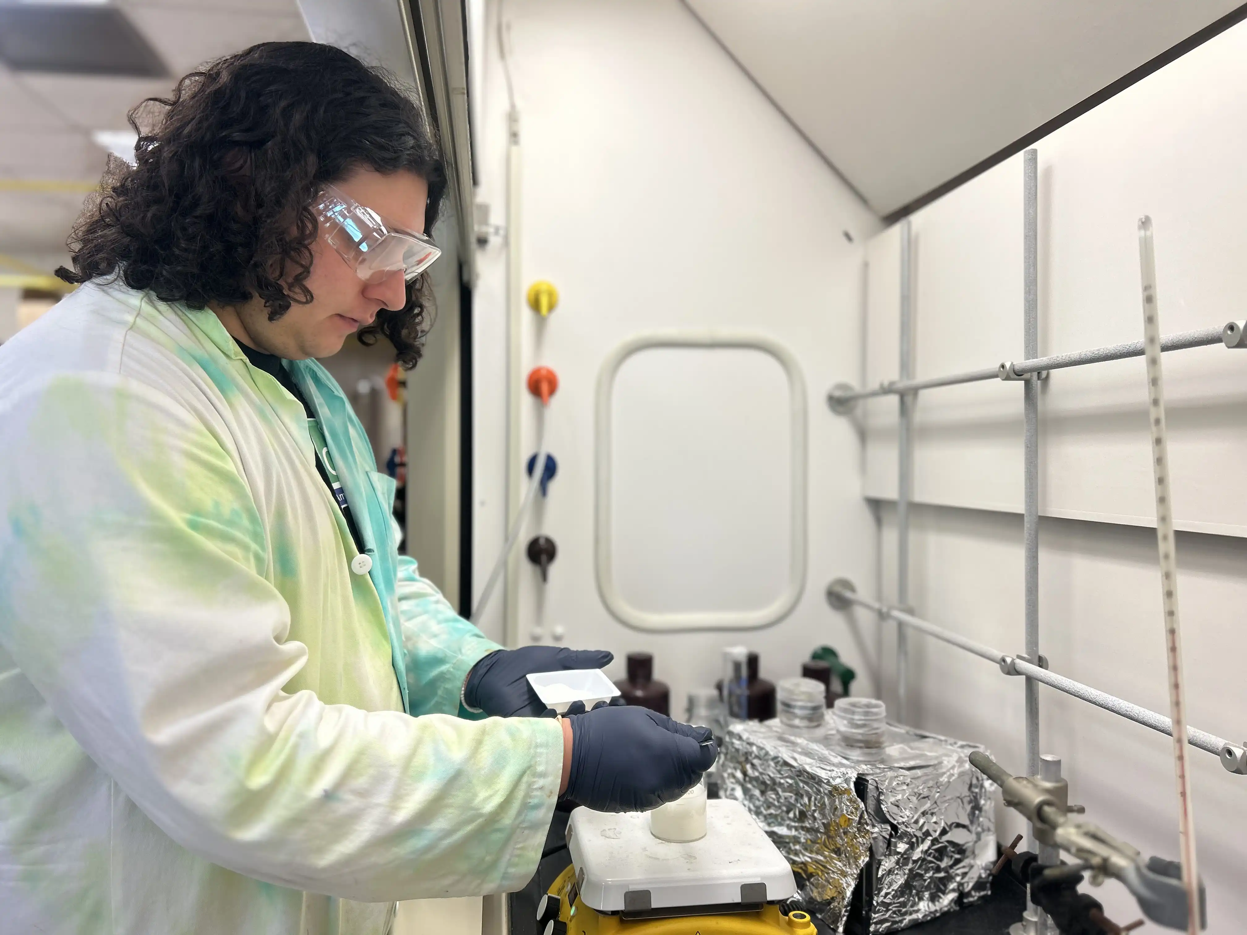 Ethan Yager conducting research in a lab on campus.