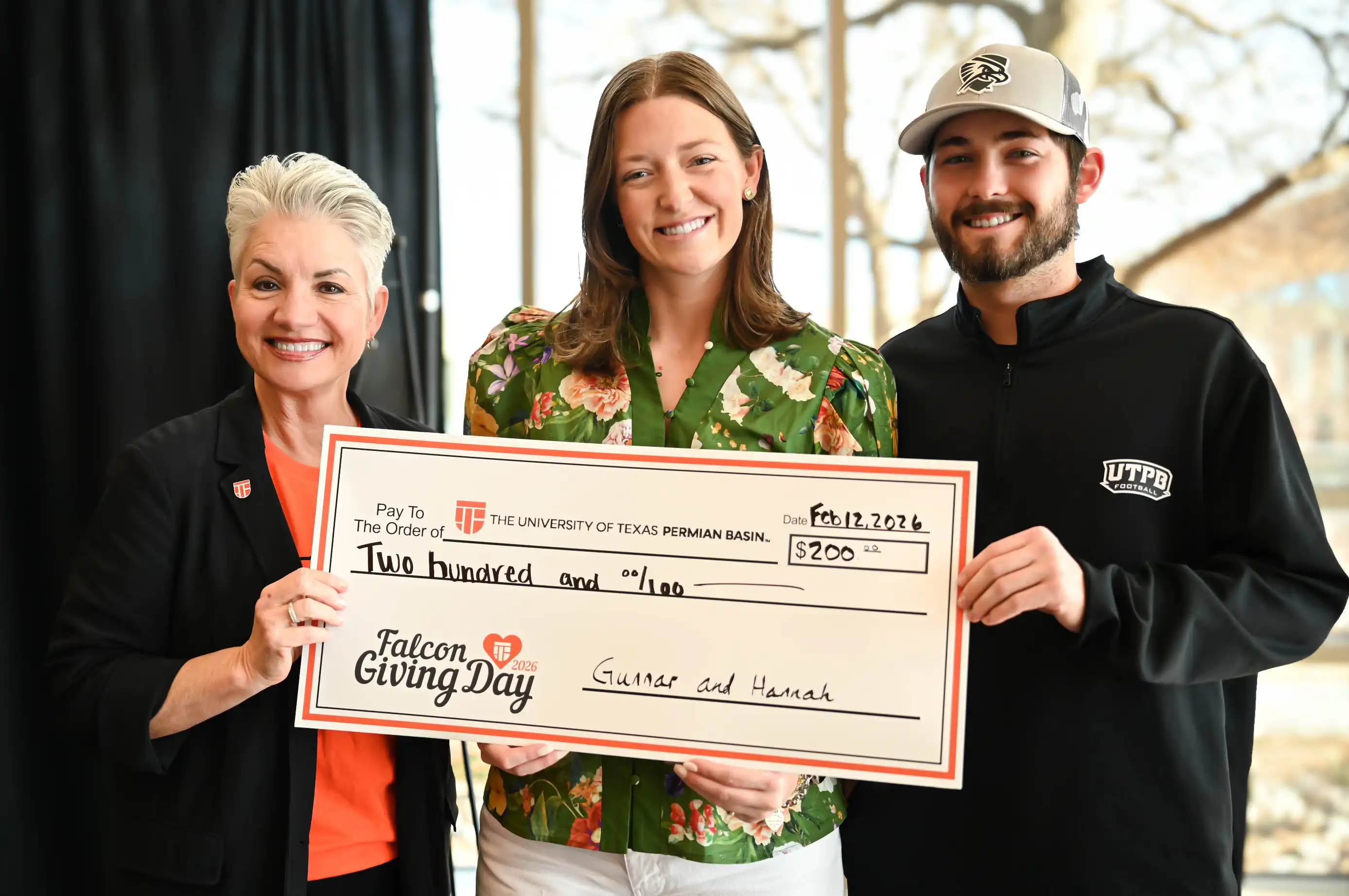 Hannah Gore and Gunnar Abseck with Dr. Sandra Woodley on Falcon Giving Day. 