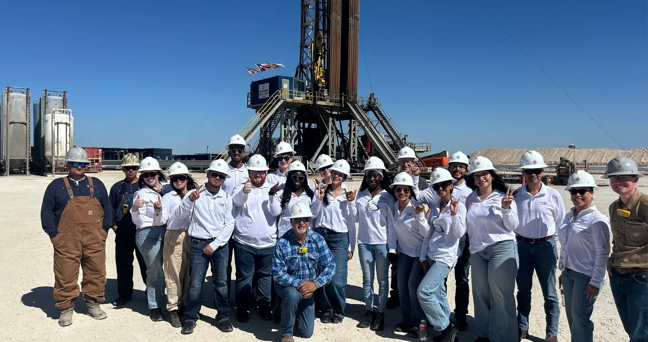 A photo of the University Lands of the UT System interns on a site visit at a drilling pad. 