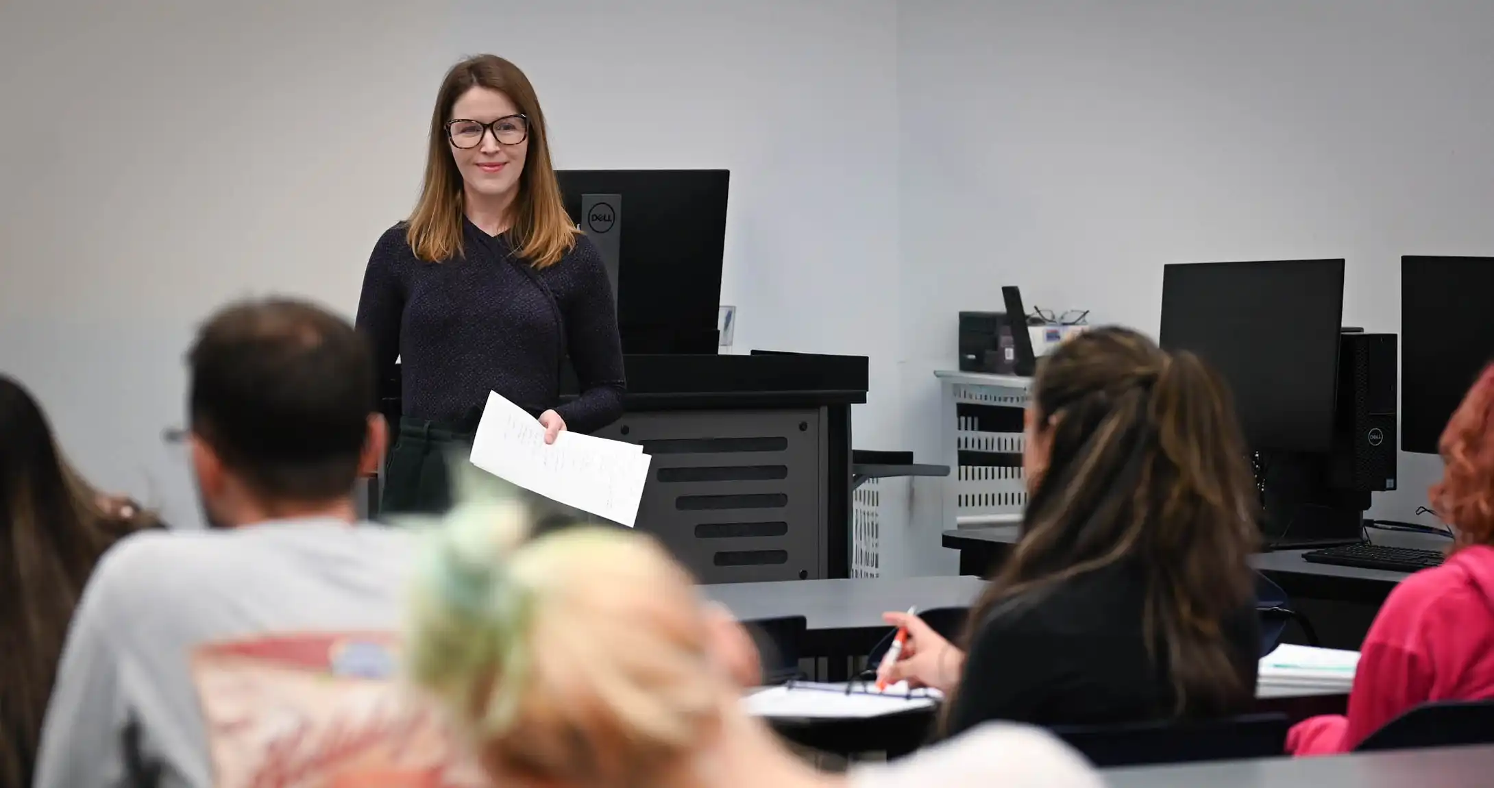 Alissa Adams lecturing a class at UTPB.