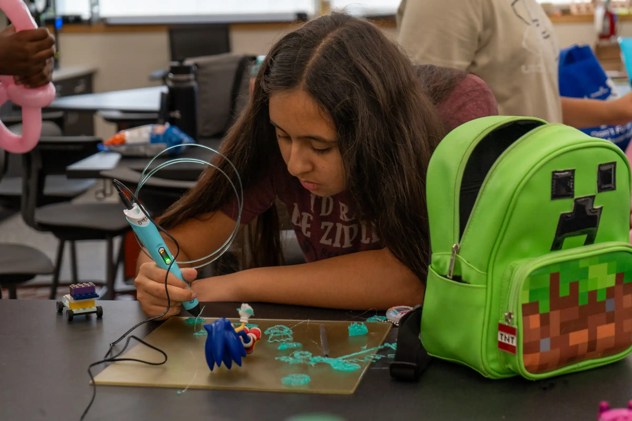 Camp participant working on a project in the UTPB MakerSpace.