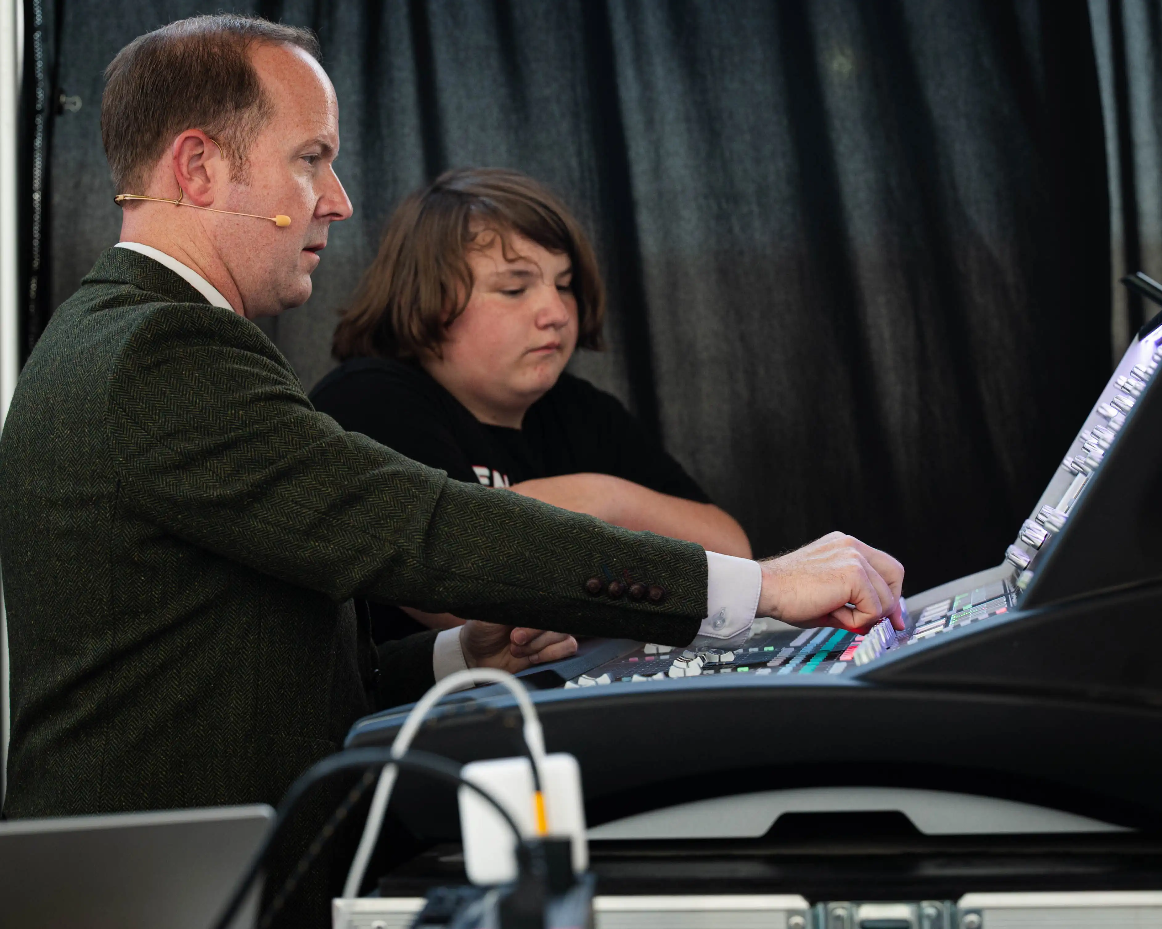 Eric Baker adjusting the sound machine at the performance.