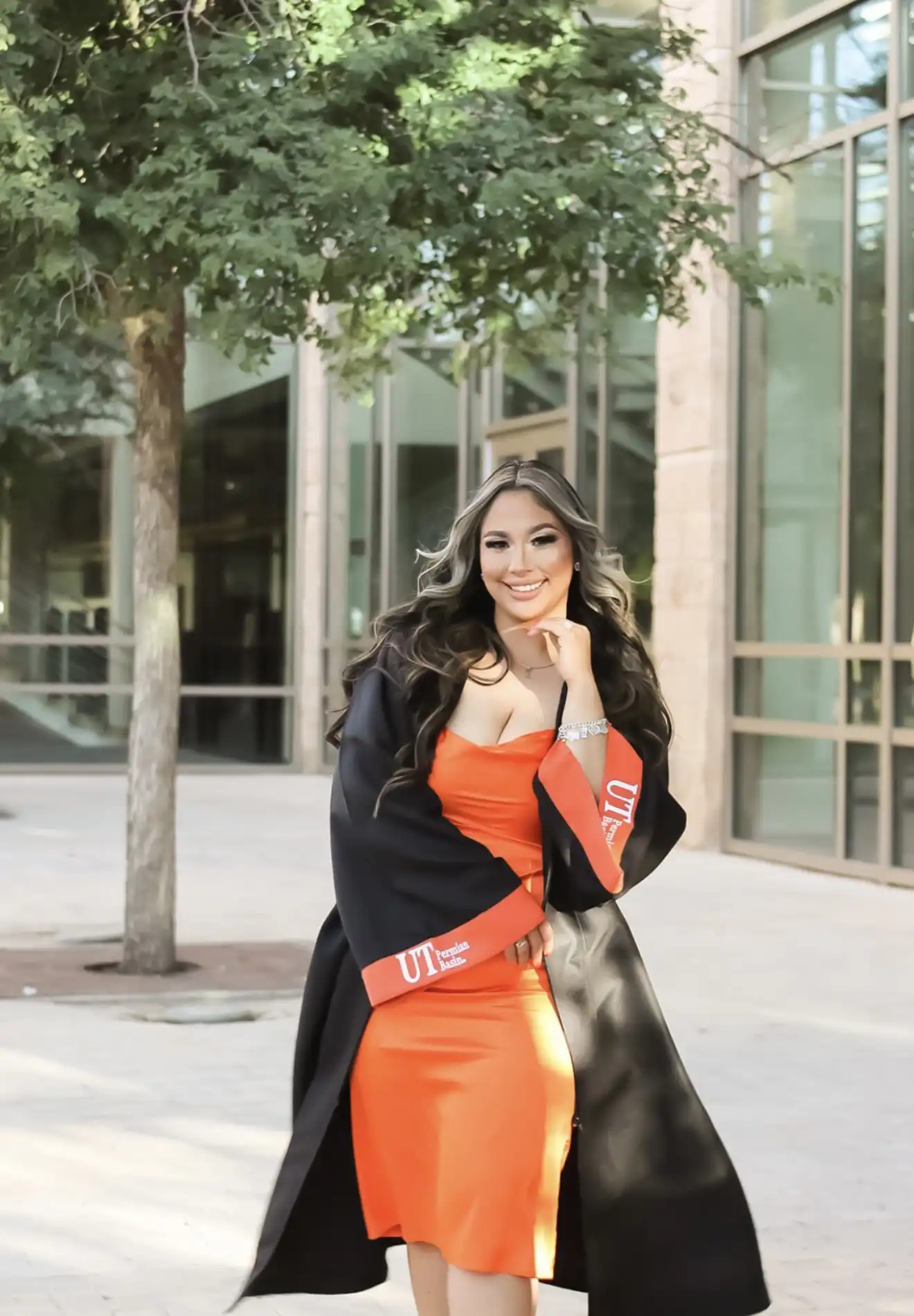 Mariah posing for her graduation photos in UTPB regalia.