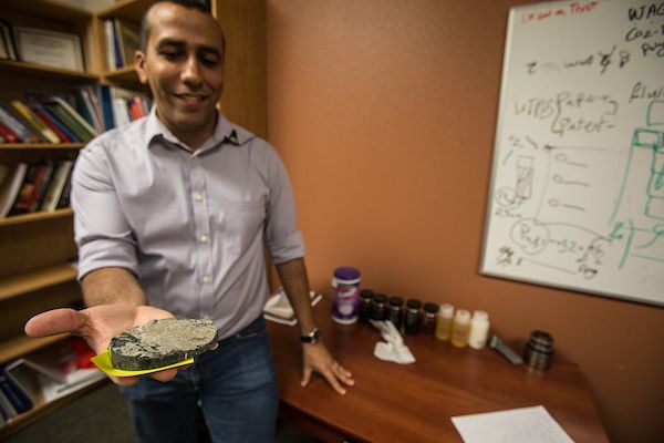 Dr. Alzahabi holding rock