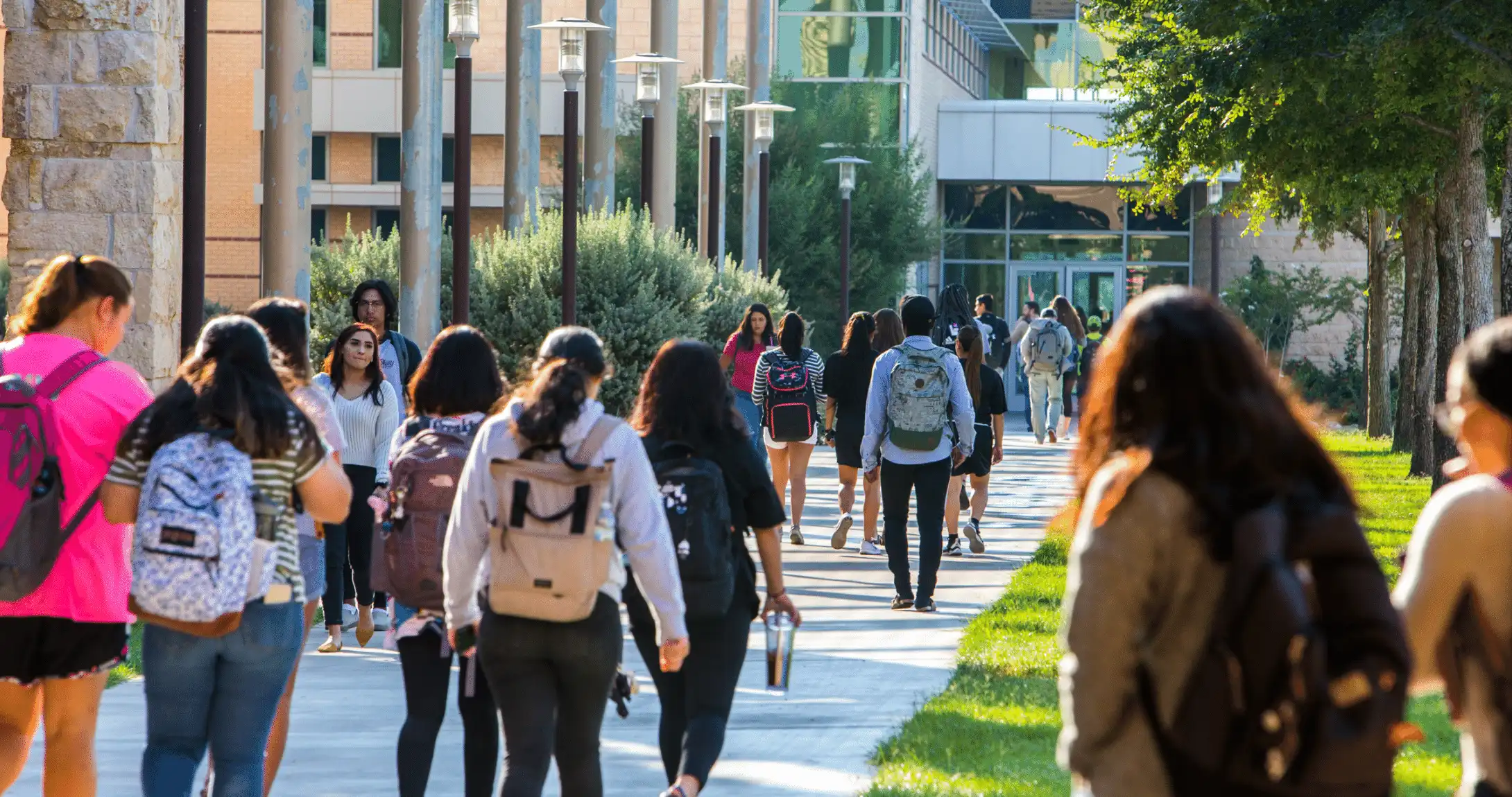 students on campus side walk