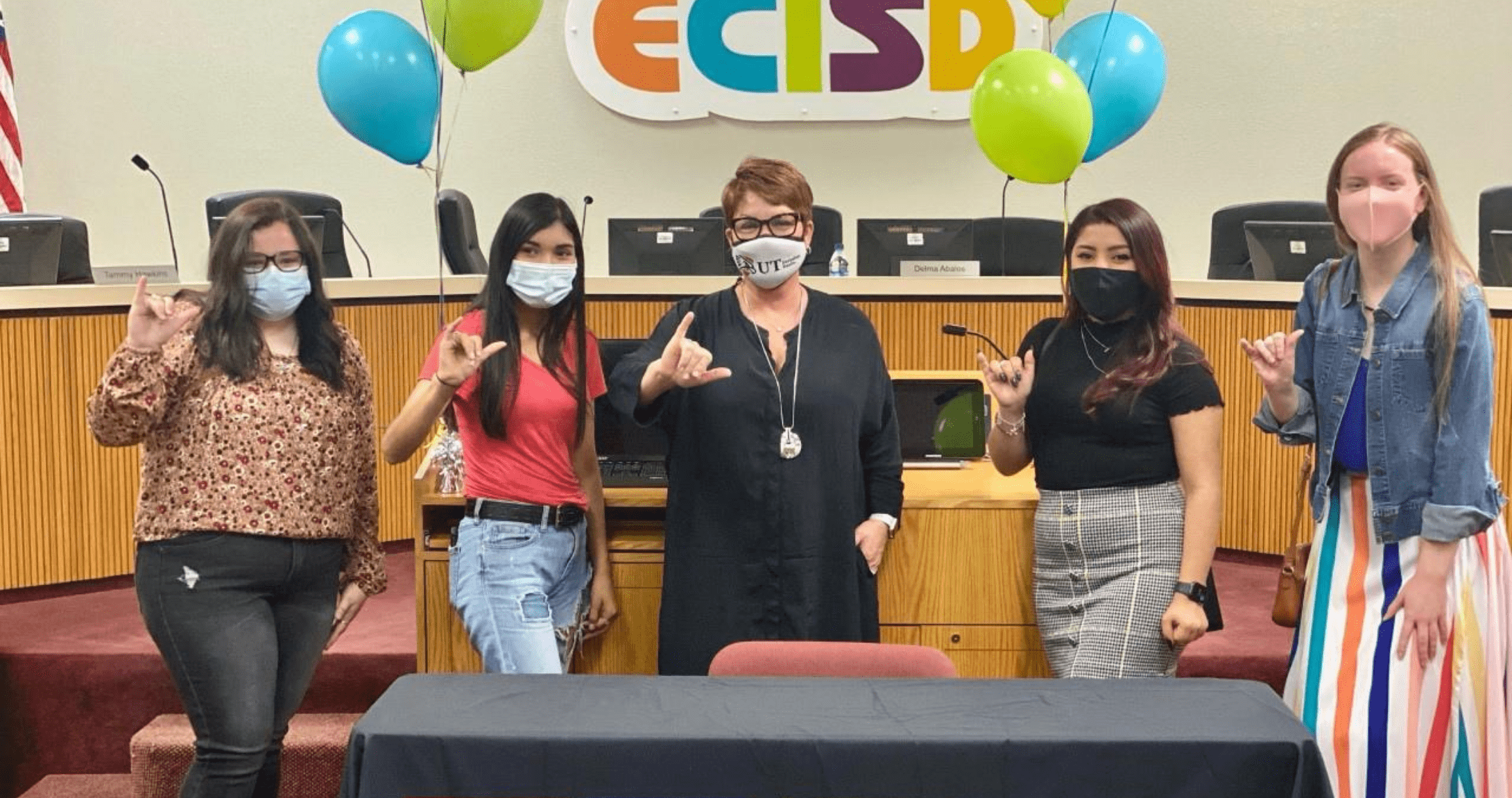 Dr. Woodley stands with scholarship recipients