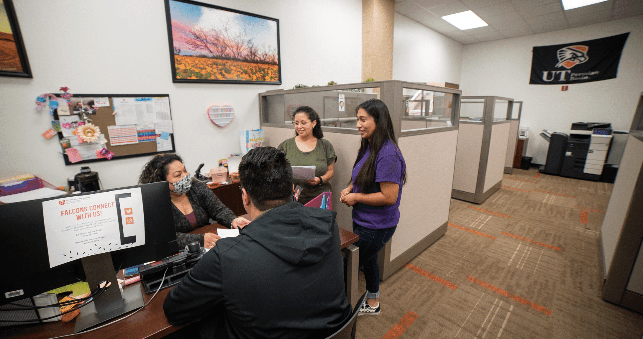 students talking to financial aid counselor 