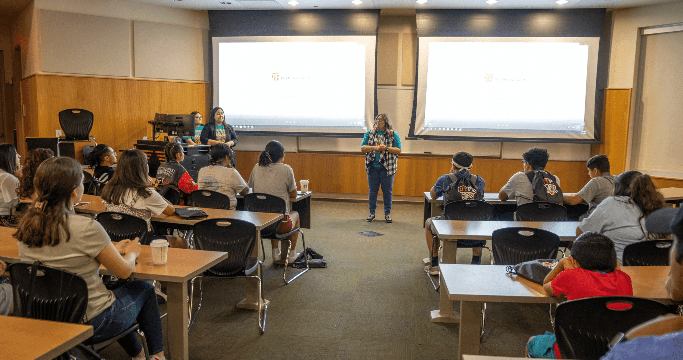 director speaking to room of students