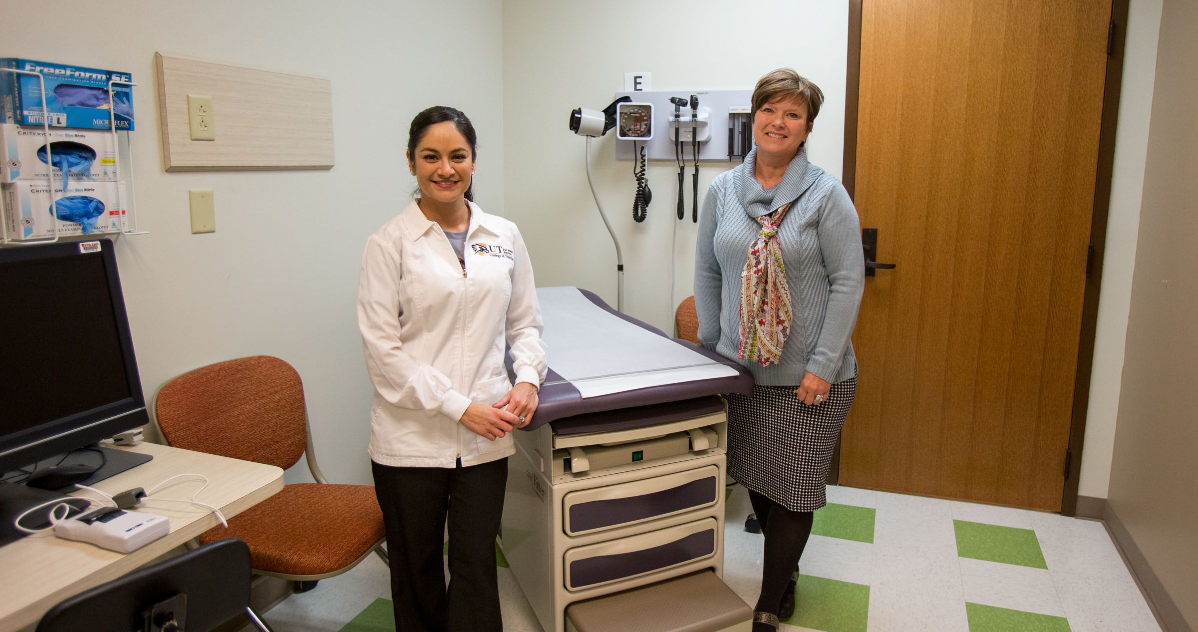 Dr. Ruiz and Dr. Buek smile for picture in nursing lab