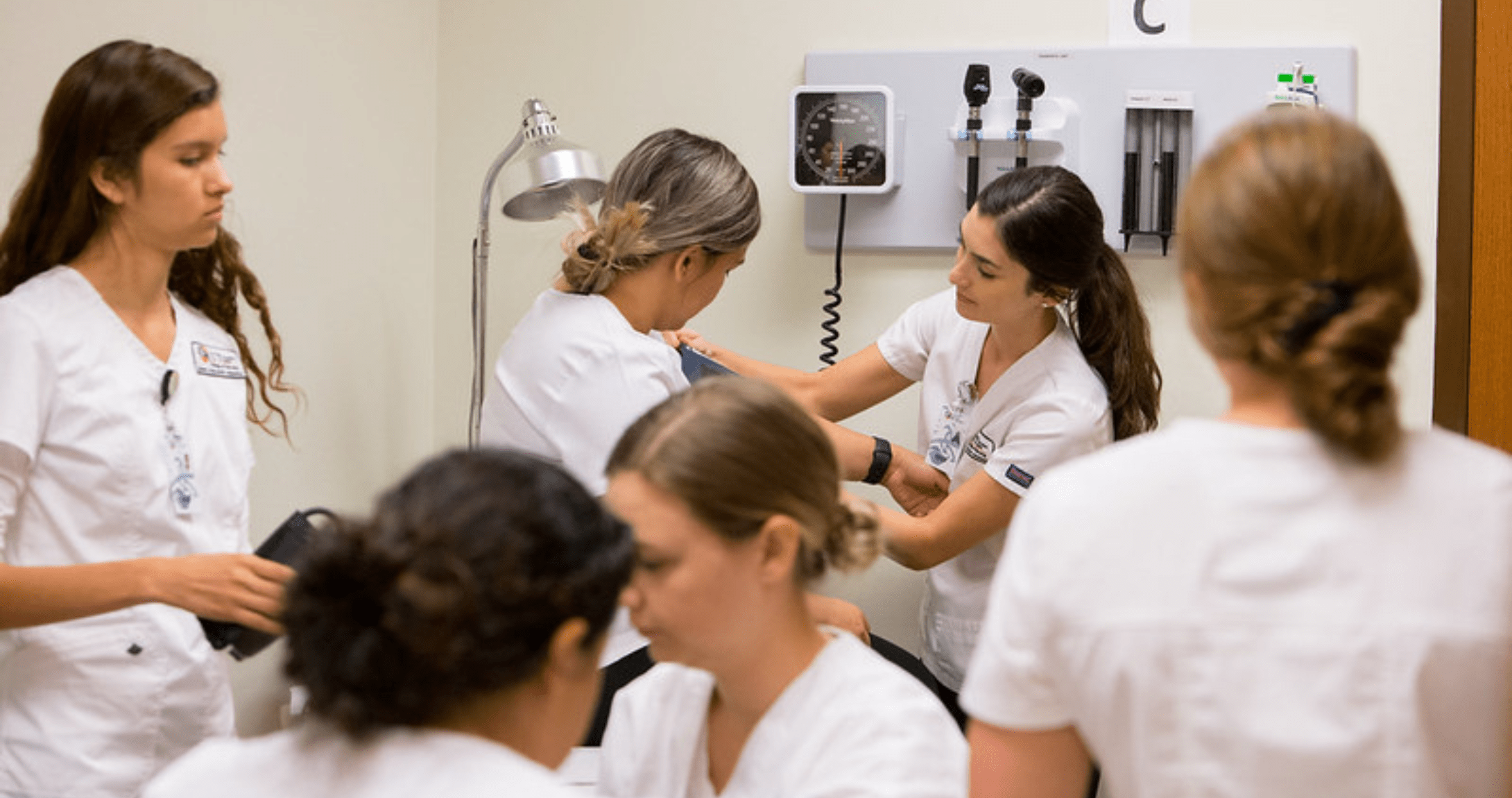 nursing students taking blood pressure