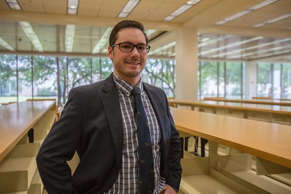 Steve Lively smiling in library