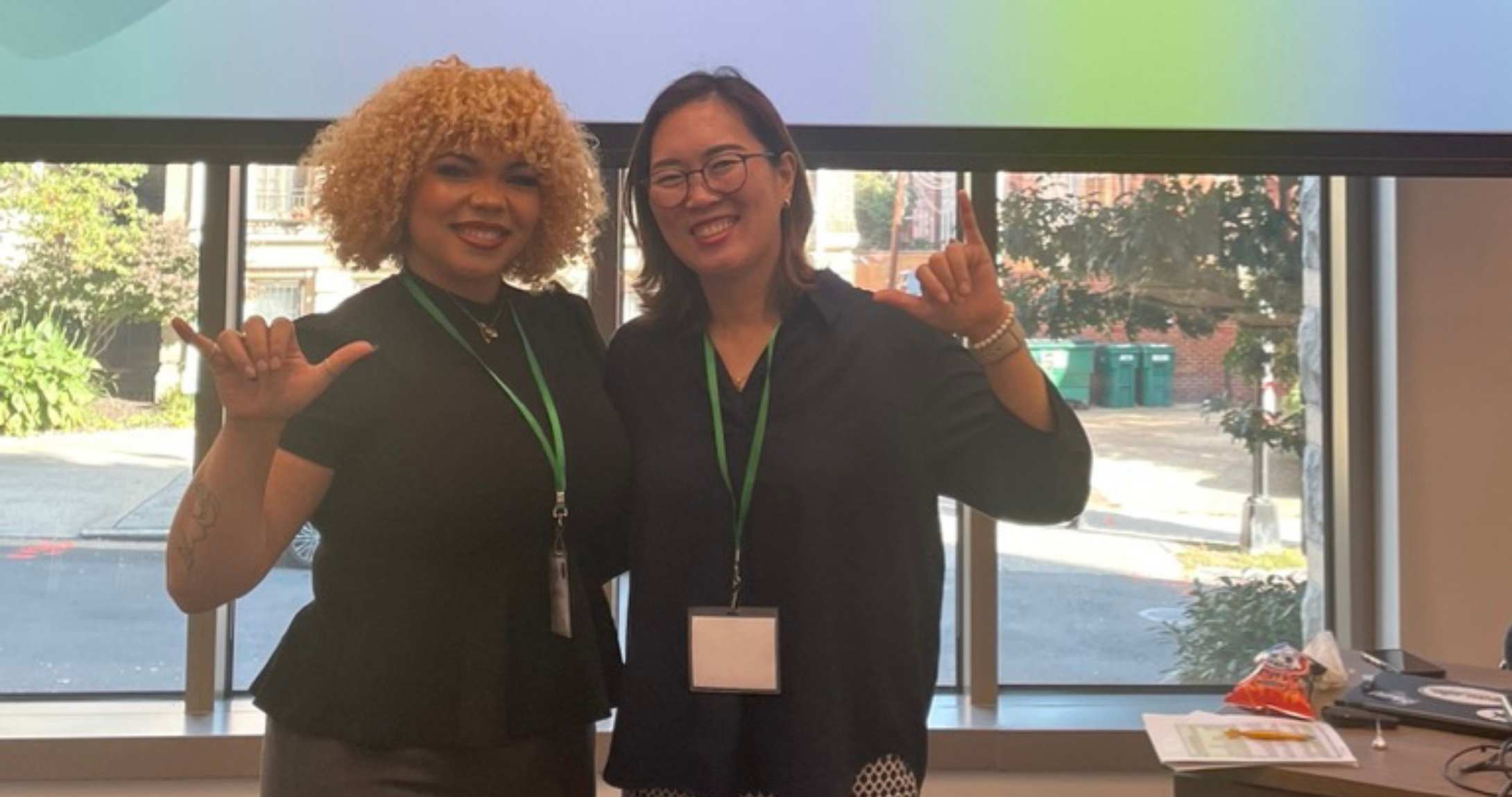 student with professor smiling at camera