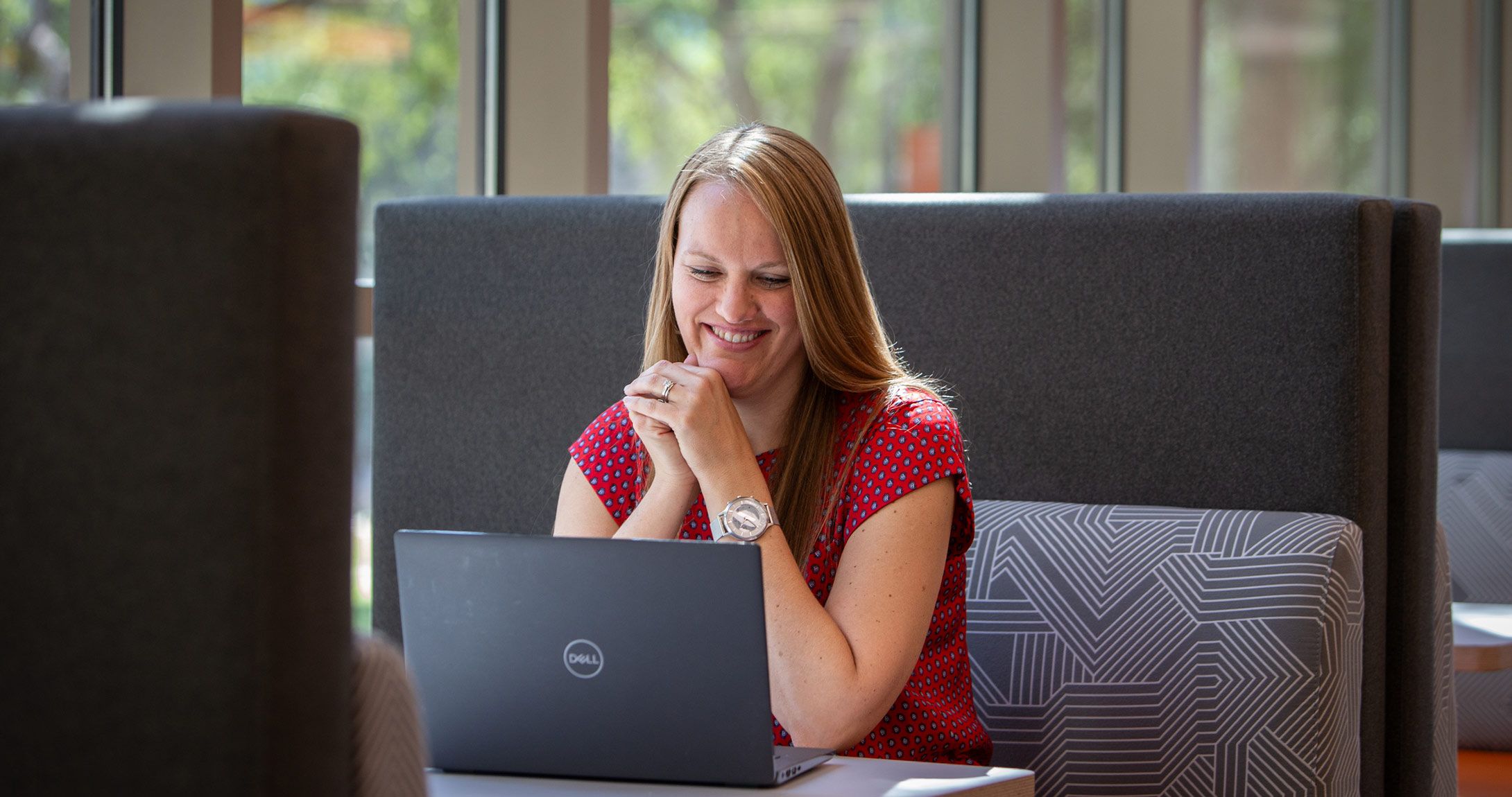 Tiffany Collier smiling at computer 