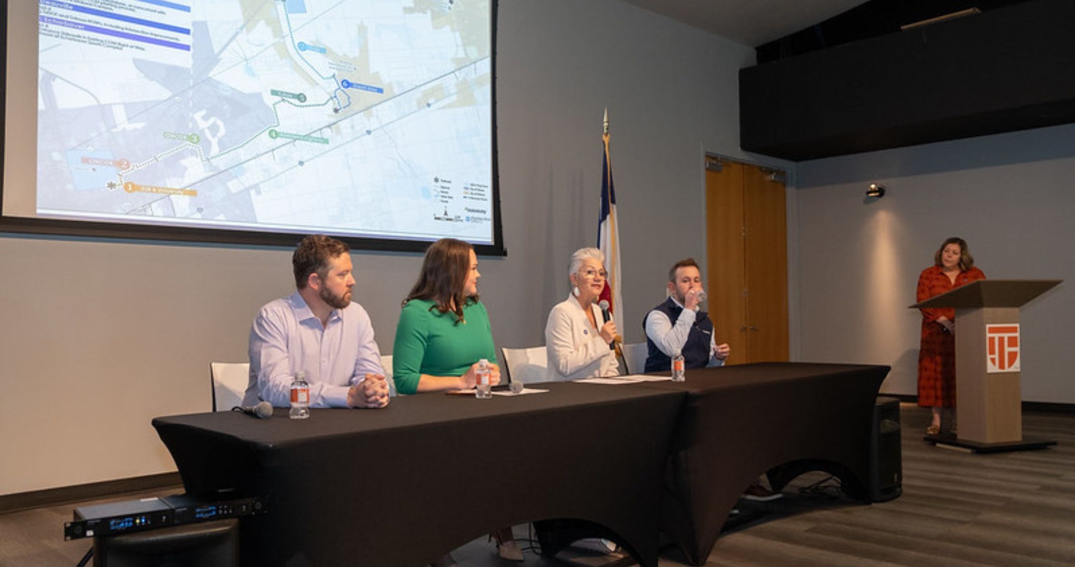 panel of speakers at press event
